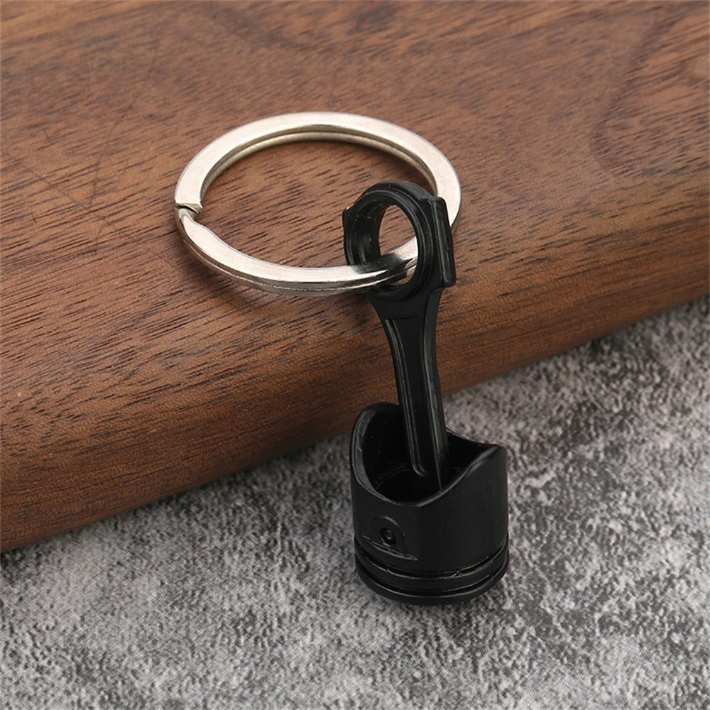 Porte clé en forme de piston