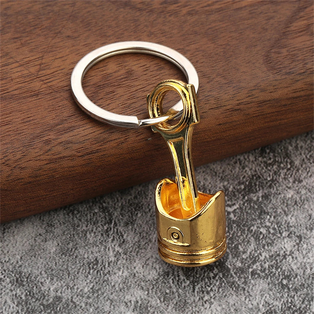 Porte clé en forme de piston