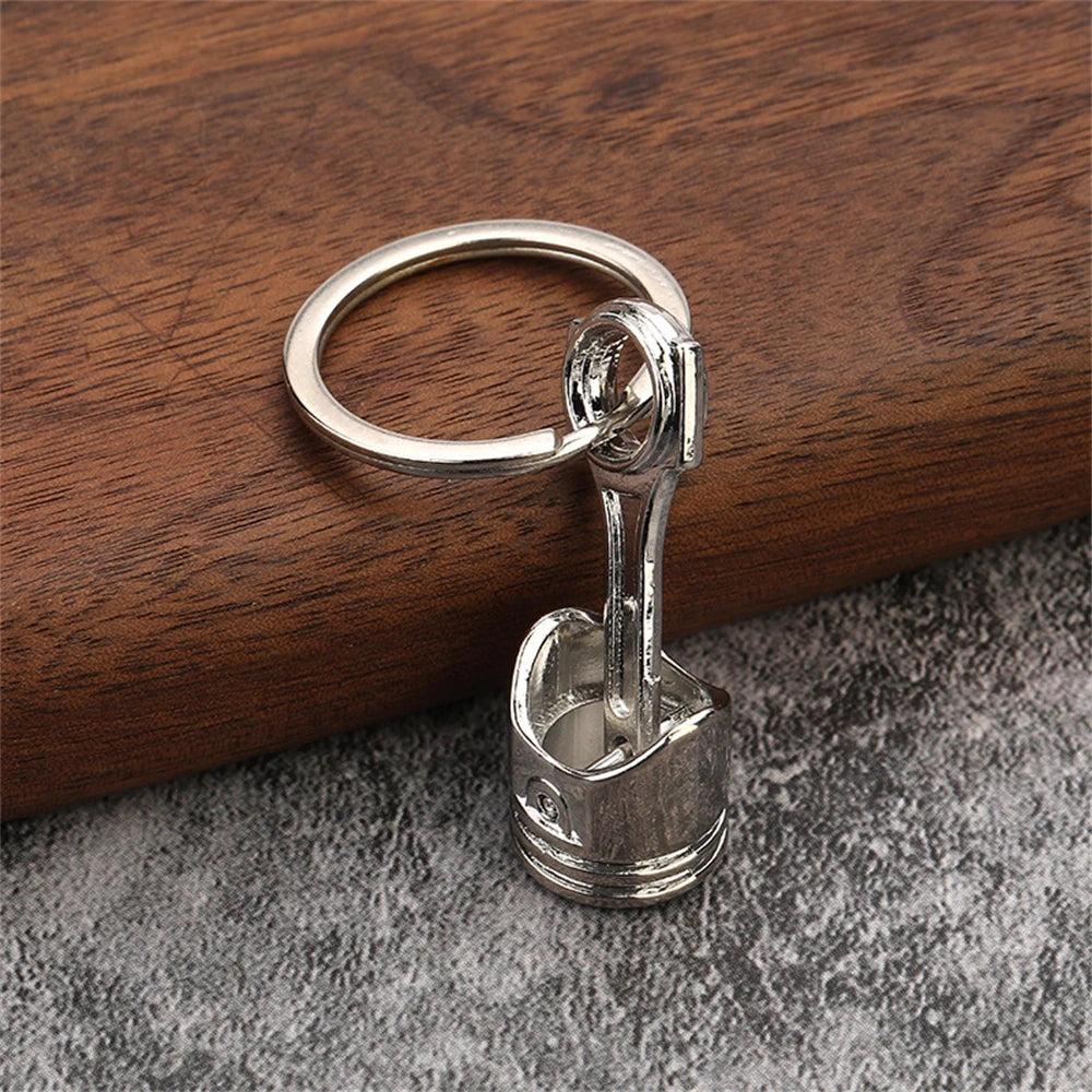 Porte clé en forme de piston