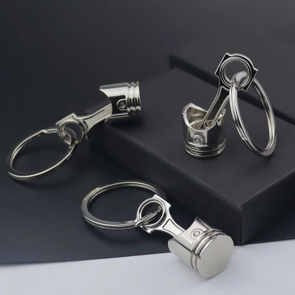 Porte clé en forme de piston